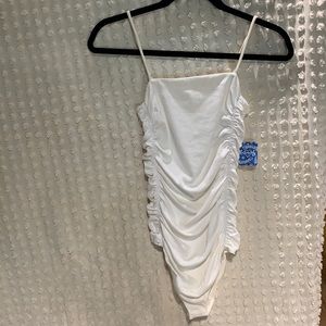 Free people brand size s body suit- it fits more like a medium white